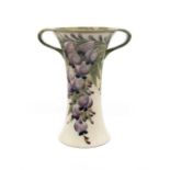 William Moorcroft for Macintyre & Co 'Wisteria' pattern twin handled vase. Height approx 20.5cm.