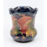 A small Moorcroft pomegranate vase with fluted top, signed, approx. 9cm high. Condition: good