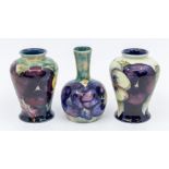 Three pieces of Moorcroft, including an early signed vase - Pansy pattern, approx. 8.5cm high. Along