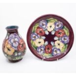 Moorcroft Pottery - 'Pansy' vase (second quality) and a charger