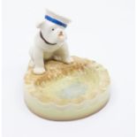 A Beswick bulldog with sailor cap titled HMS, sat upon an ashtray in good condition, no damage or