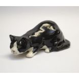 Winstanley black & white cat in crouched position. Length approx 33cm. Signature and number 5 to