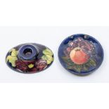 Moorcroft pottery: A Walter Moorcroft 'Anemone' pattern oval low candle holder on a blue ground plus
