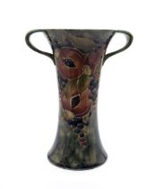 William Moorcroft for Liberty & Co 'Pomegranate' pattern twin handled vase. Height approx 20.5cm.