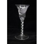 An extremely rare engraved mixed colour twist wine glass, circa 1760-1765, bell bowl engraved with a