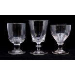 Three rummer glasses, the shortest with a capstan stem circa 1790, the intermediate with a plain