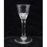 A Georgian early facet cut stem wine glass, circa 1770, ogee bowl with slice and petal cutting,
