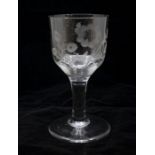 An 18th century plain stemmed goblet, circa 1750, very large ogee bowl engraved with a carnation and