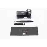 A Mont Blanc Meisterstuck fountain pen, black lacquer body with gilt band detail, signed '