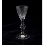 A Georgian facet cut stem wine glass, circa 1780, round funnel bowl with polished and cut lower