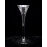An 18th century toasting glass, circa 1775, very fine drawn trumpet bowl and fine stem on a