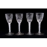 Four Dutch opaque twist stem wine glasses, circa 1780-1790, engraved with sunflowers, ears of
