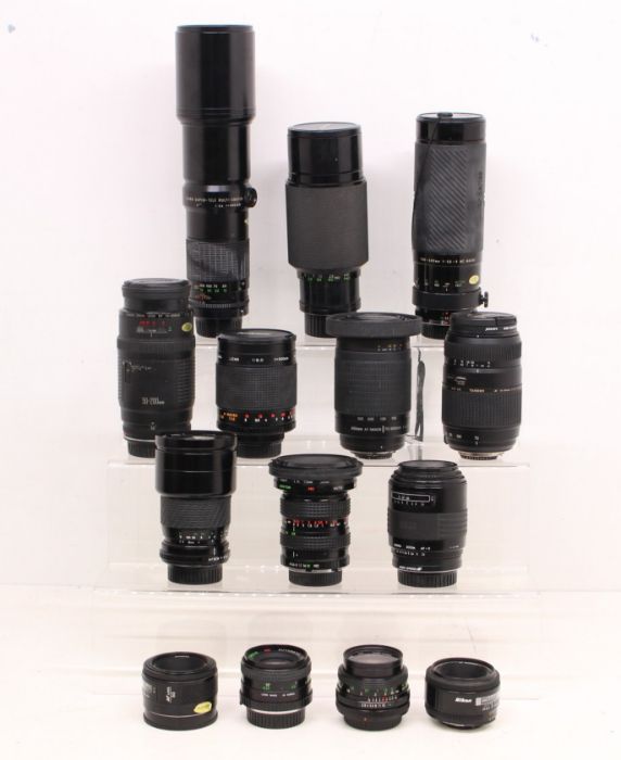 Lenses: A collection of assorted camera lenses to include: Minolta 50mm 1:1.7; Nikon AF Nikkor 70-