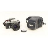 Nikon: A cased Nikon F camera body, 6845092, generally in good condition, in need of a clean,