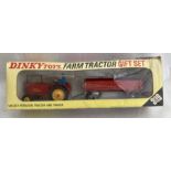 Dinky: A boxed Dinky Gift Set 399, Farm Tractor and Trailer. Contains Massey Ferguson Tractor with