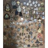 Large collection of Military cap & uniform badges.