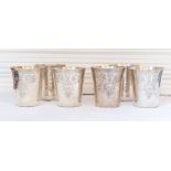 Set of six silver Beakers of straight tapered form with flared rims and engraved floral leafage