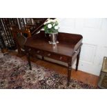 An early 19th century mahogany washstand in the manner of Gillows, Lancaster, with three-quarter