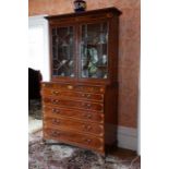 A George III mahogany secretaire bookcase, with shell and paterae inlay, satinwood banded to the