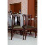 A set of four Queen Anne style mahogany dining chairs with scallop carved splats    Cond: all good