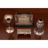 An Edward VII silver triple compartment Stamp Box, on ball feet, Sheffield 1902, Walker and Hall;