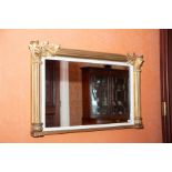 A William IV parcel gilt and white painted overmantel mirror, the frame as flutes pilasters trimmed