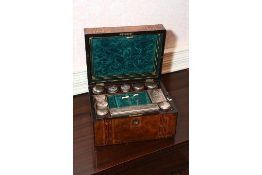 A Victorian walnut inlaid Toiletry case containing silver plated lidded jars and glass toiletry - Image 2 of 3