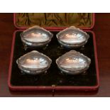 A Set of Four silver boat-shape Salts, with wavy shaped rims and raised on cabriole supports,