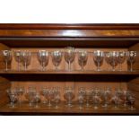 A thirty-nine piece suite of crested drinking glasses, late 19th century, each with quatre-lobed