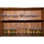 A set of 12 star cut small champagne glasses circa 1910. Seven other assorted champagnes (3 plus