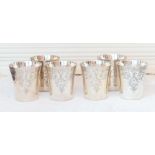 A Set of six silver Beakers of straight tapered form with flared rims and engraved floral leafage