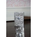 A Chinese silver card Case embossed dragon to the front with shield shape cartouche engraved ‘Ethel
