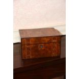 A Victorian walnut inlaid Toiletry case containing silver plated lidded jars and glass toiletry