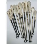 A selection of 11 silver handled button hooks of varying designs. (11)