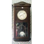 German wall clock with 7" silvered dial, 2 train spring driven movement, chiming on a gong.