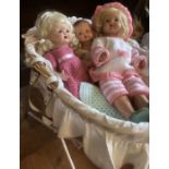 Quantity of Vintage composition dolls in a child’s vintage cot on stand for dressing and display.(