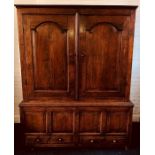 An early George III welsh oak livery cupboard, circa 1760, moulded cornice above two moulded arch