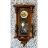 Vienna wall clock with 2 train spring driven movement, chiming on a gong. With 6" 2 piece dial,