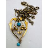 An Edwardian yellow metal and turquoise floral pendant, stamped 9ct, on a Belcher chain, also