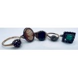 A selection of five rings, comprising a 9ct gold hematite intaglio signet ring (Size U,