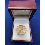 A 1913 half Sovereign in a raised 9ct gold  scroll open work ring setting. Gross weight