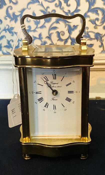 French carriage clock by Rapport Frank. Single train sprung driven movement, brass Serpentine case