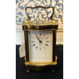 French carriage clock by Rapport Frank. Single train sprung driven movement, brass Serpentine case