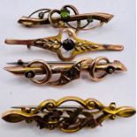 Four late Victorian yellow metal gem set bar brooches. One set with garnet and seed pearls,