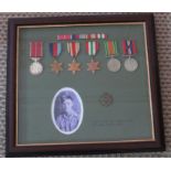 A framed group of WWII medals awarded to Staff SGT Clarence Kall . Royal Army Corps. To include