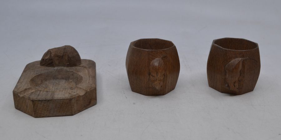 Workshops of Robert Mouseman Thompson, a pair of oak octagonal napkin rings, 5cm(H); together with