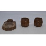 Workshops of Robert Mouseman Thompson, a pair of oak octagonal napkin rings, 5cm(H); together with