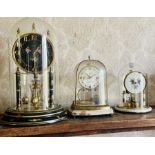 ****WITHDRAWN***** A 20th century brass and glass Kieninger & Oberofell anniversary clock; another