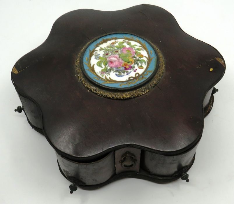 A 19th century trinket  box with pull out rotating compartments with a Servres style porcelain