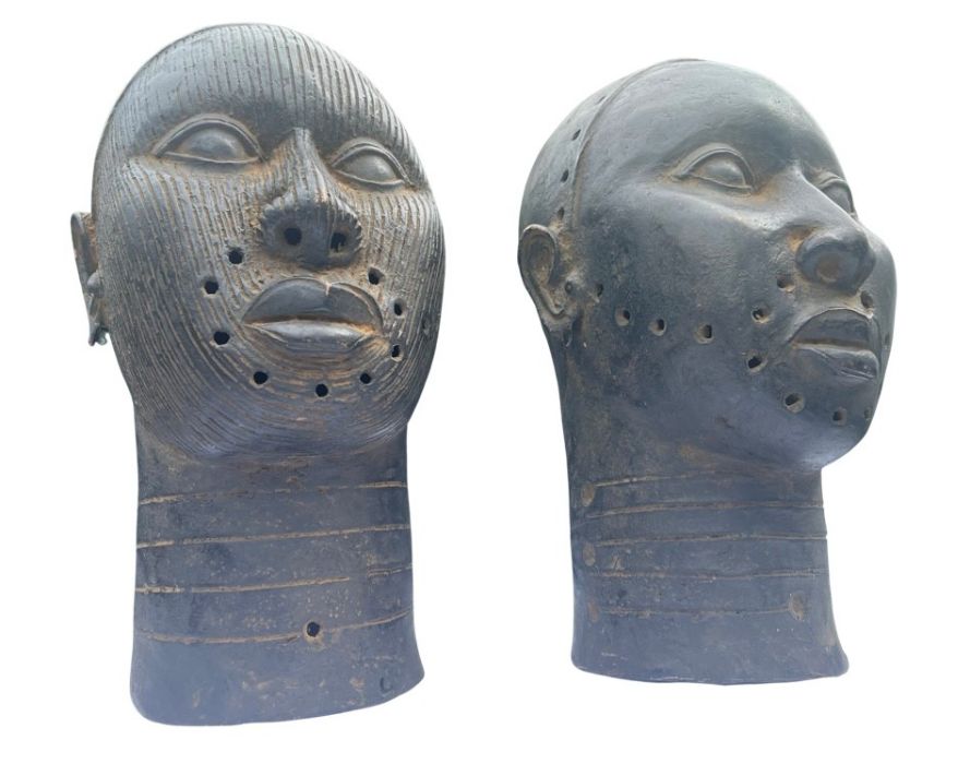 A pair of 20th century bronze Ife heads from Nigeria. Approximately 31 cms in height. Please note